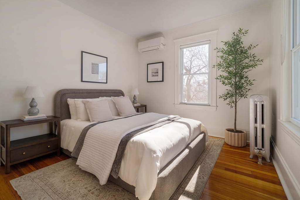 182 Maplewood Street, Unit 2 Watertown, MA 02472 - Photo 17 of 42 a bedroom with bed and window