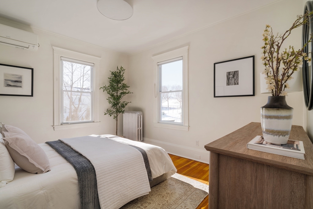 182 Maplewood Street, Unit 2 Watertown, MA 02472 - Photo 18 of 42 a bedroom with a bed and a window