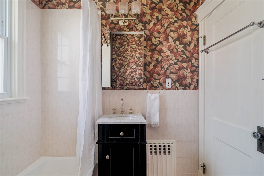 182 Maplewood Street, Unit 2 Watertown, MA 02472 - Photo 20 of 42 a bathroom with a sink and a mirror