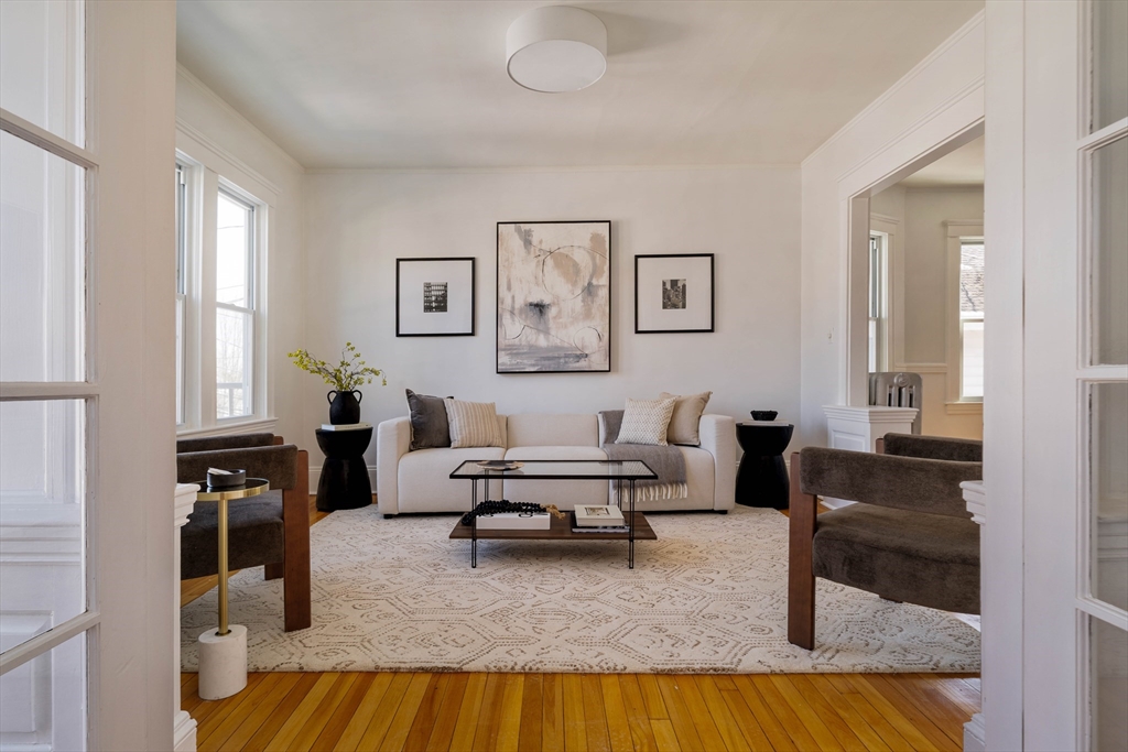 182 Maplewood Street, Unit 2 Watertown, MA 02472 - Photo 2 of 42 a living room with furniture and a couch