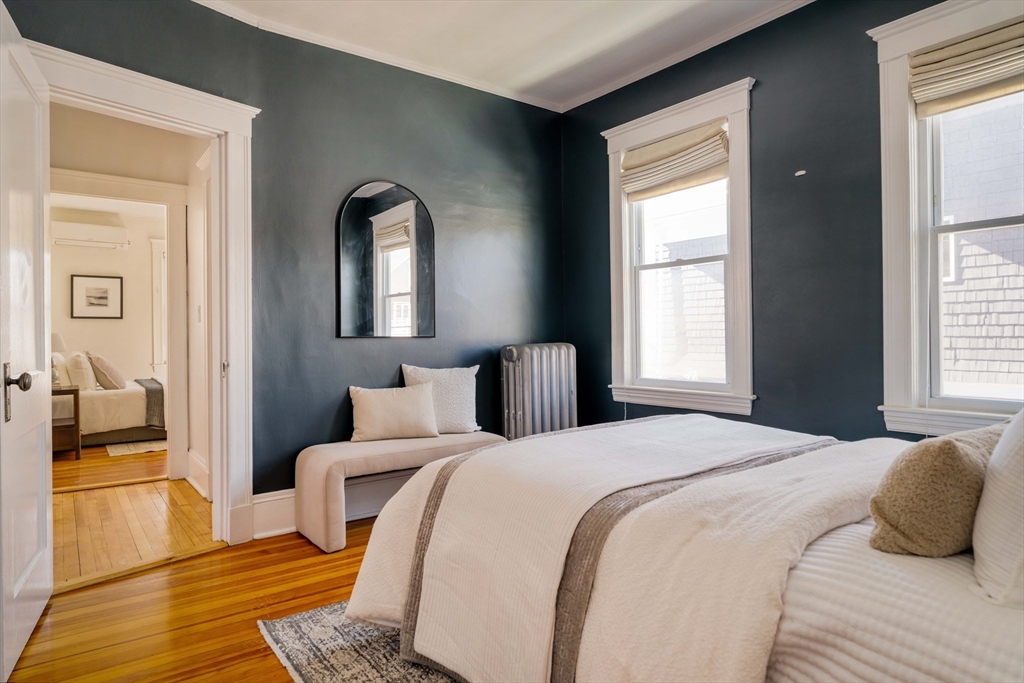 182 Maplewood Street, Unit 2 Watertown, MA 02472 - Photo 22 of 42 a bedroom with a large bed and a window