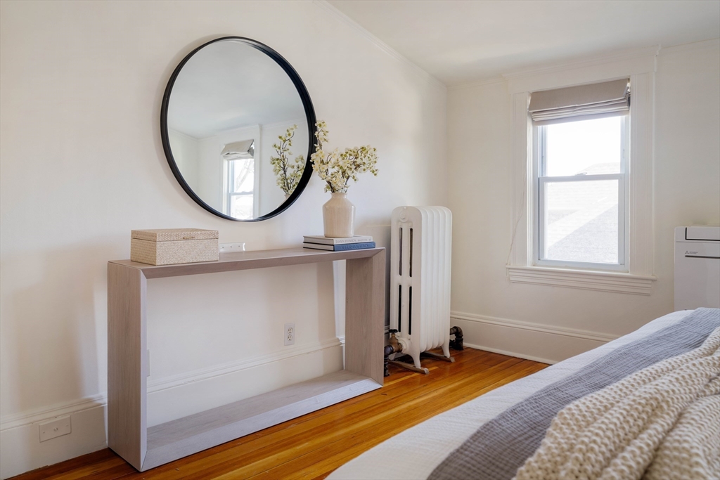 182 Maplewood Street, Unit 2 Watertown, MA 02472 - Photo 24 of 42 a view of a livingroom with furniture and a window
