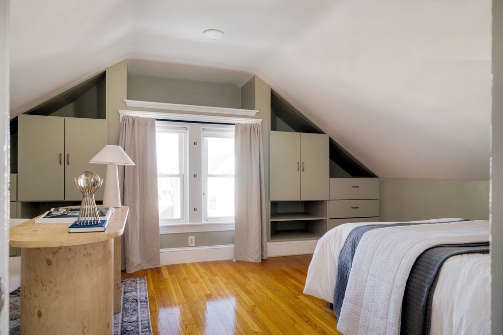 182 Maplewood Street, Unit 2 Watertown, MA 02472 - Photo 25 of 42 a bedroom with a bed and a window