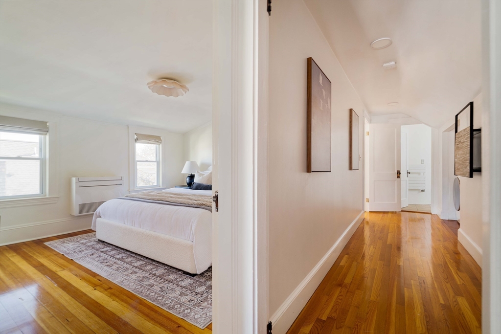 182 Maplewood Street, Unit 2 Watertown, MA 02472 - Photo 26 of 42 a spacious bedroom with a bed and window
