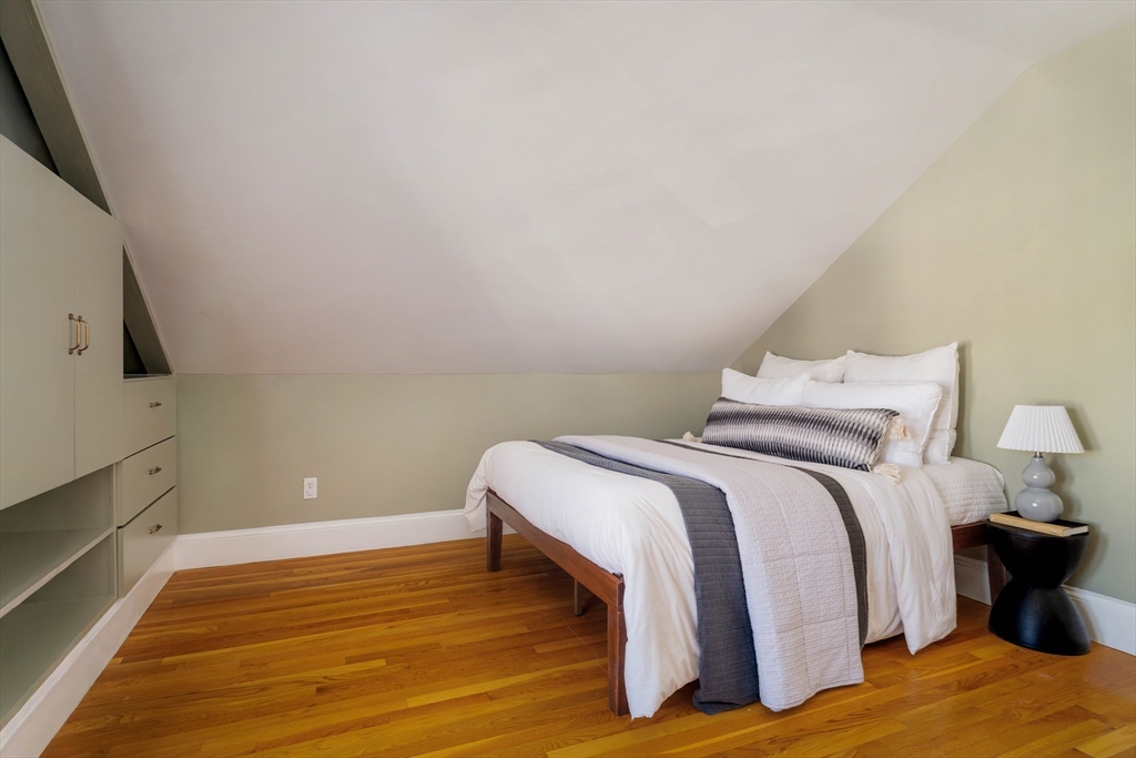 182 Maplewood Street, Unit 2 Watertown, MA 02472 - Photo 29 of 42 a bedroom with a bed and tv