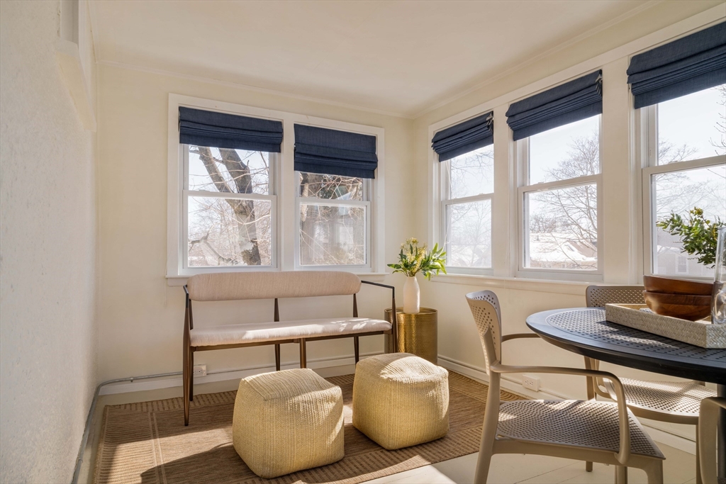 182 Maplewood Street, Unit 2 Watertown, MA 02472 - Photo 31 of 42 a living room with furniture and a window