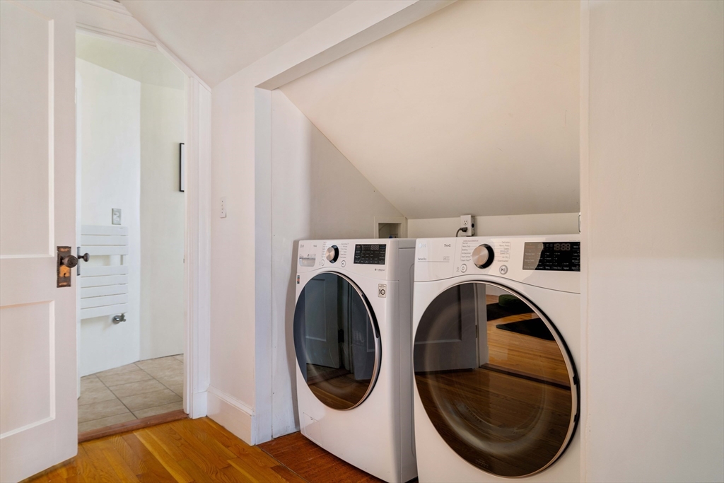 182 Maplewood Street, Unit 2 Watertown, MA 02472 - Photo 37 of 42 a view of a bedroom with washer and dryer