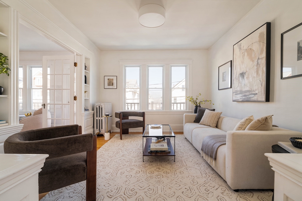 182 Maplewood Street, Unit 2 Watertown, MA 02472 - Photo 4 of 42 a living room with furniture and a large window