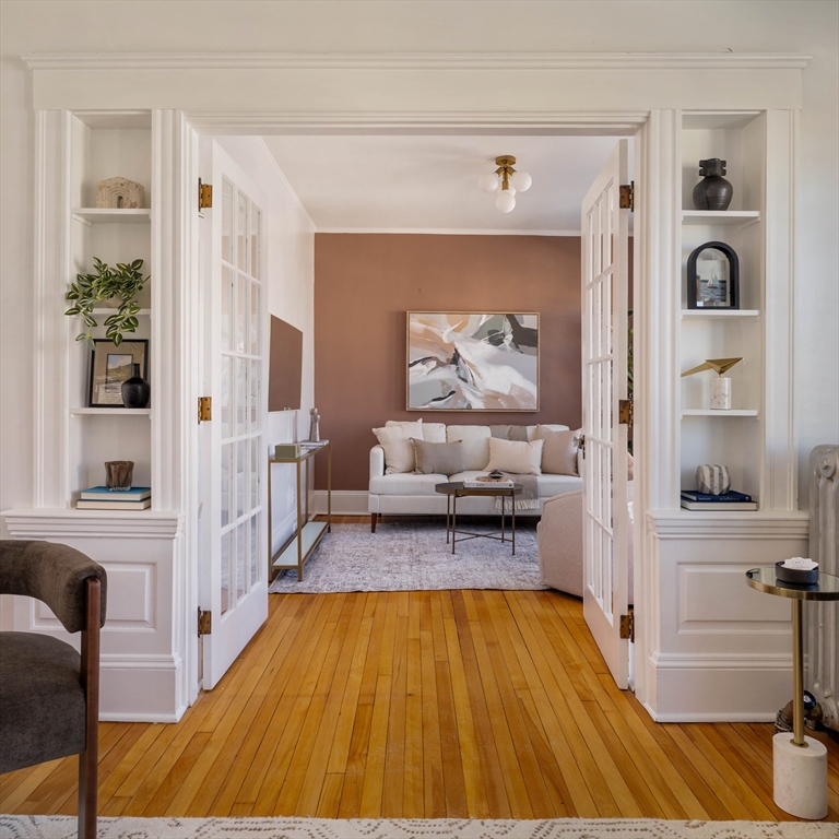 182 Maplewood Street, Unit 2 Watertown, MA 02472 - Photo 5 of 42 a room with wooden floor and furniture