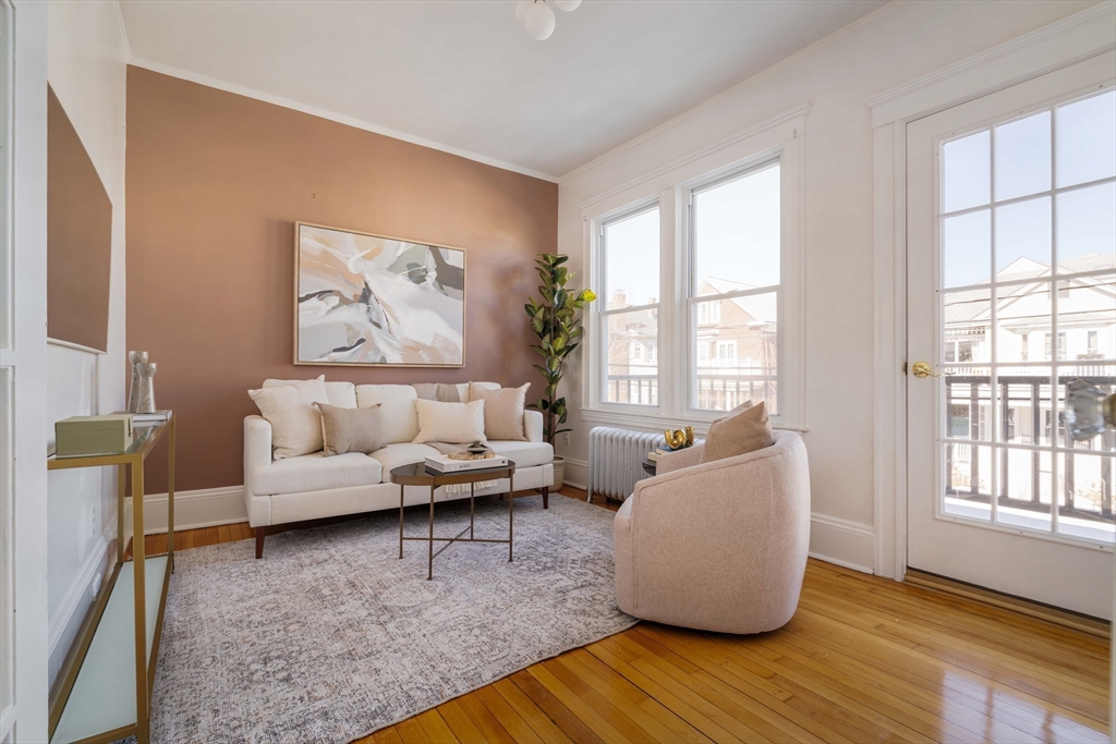 182 Maplewood Street, Unit 2 Watertown, MA 02472 - Photo 7 of 42 a living room with furniture and a large window