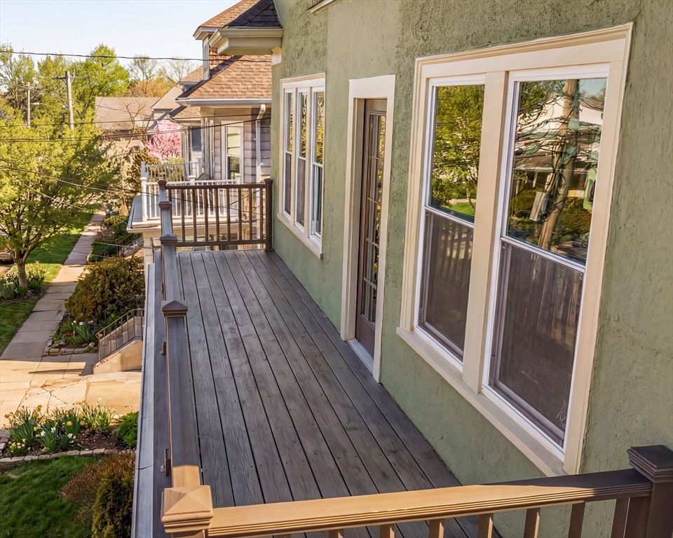 182 Maplewood Street, Unit 2 Watertown, MA 02472 - Photo 8 of 42 a view of balcony with wooden floor and fence