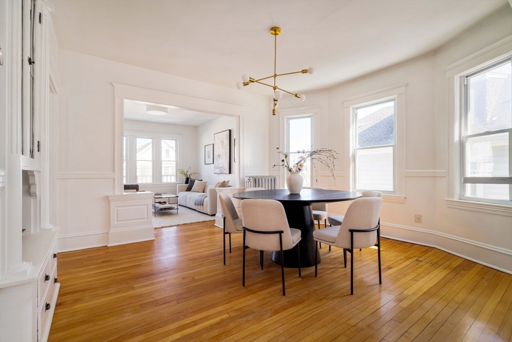 182 Maplewood Street, Unit 2 Watertown, MA 02472 - Photo 9 of 42 a view of a dining room with furniture window and wooden floor