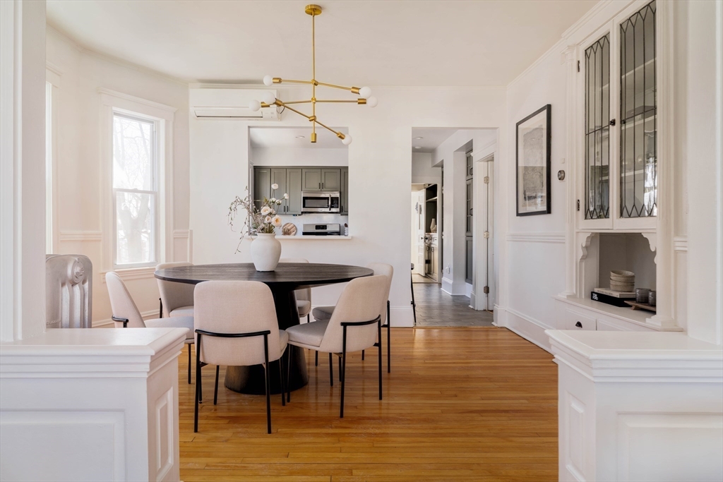 182 Maplewood Street, Unit 2 Watertown, MA 02472 - Photo 10 of 42 a living room with furniture a fireplace and a flat screen tv