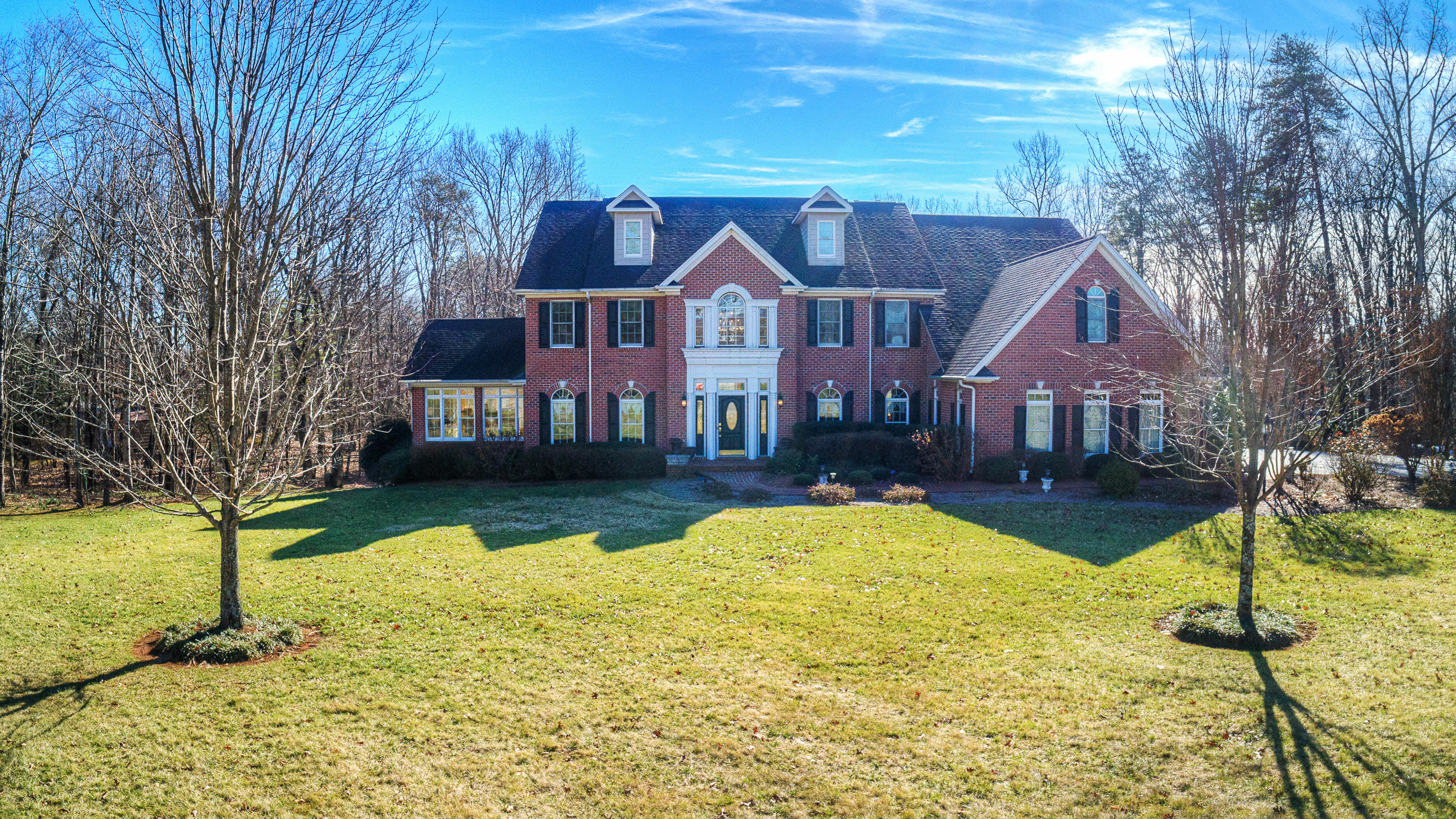 124 Massey Road Stuart, VA 24171 - Photo 1 of 42 a front view of a house with a yard