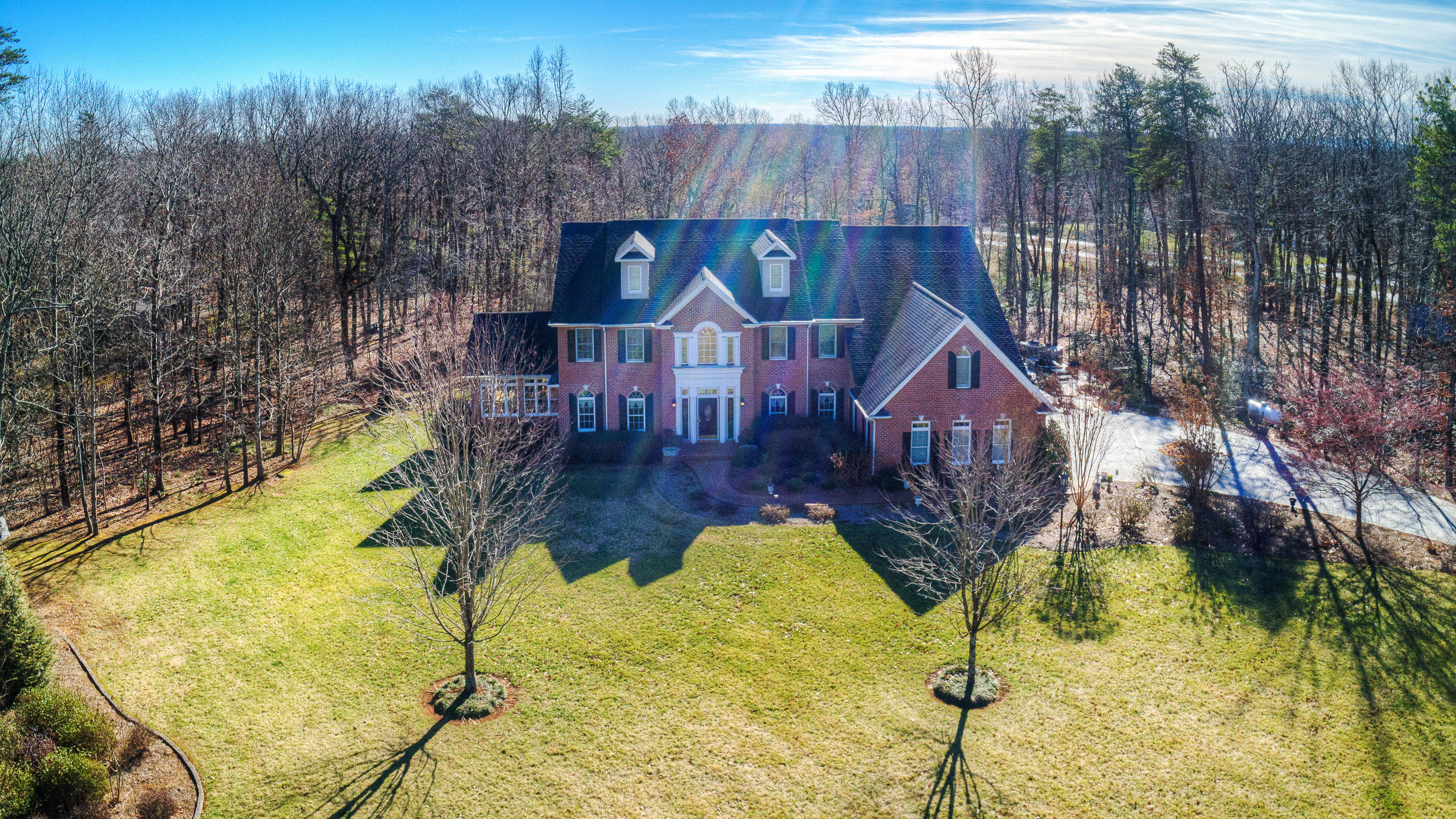 124 Massey Road Stuart, VA 24171 - Photo 2 of 42 a aerial view of a house with swimming pool in front of house