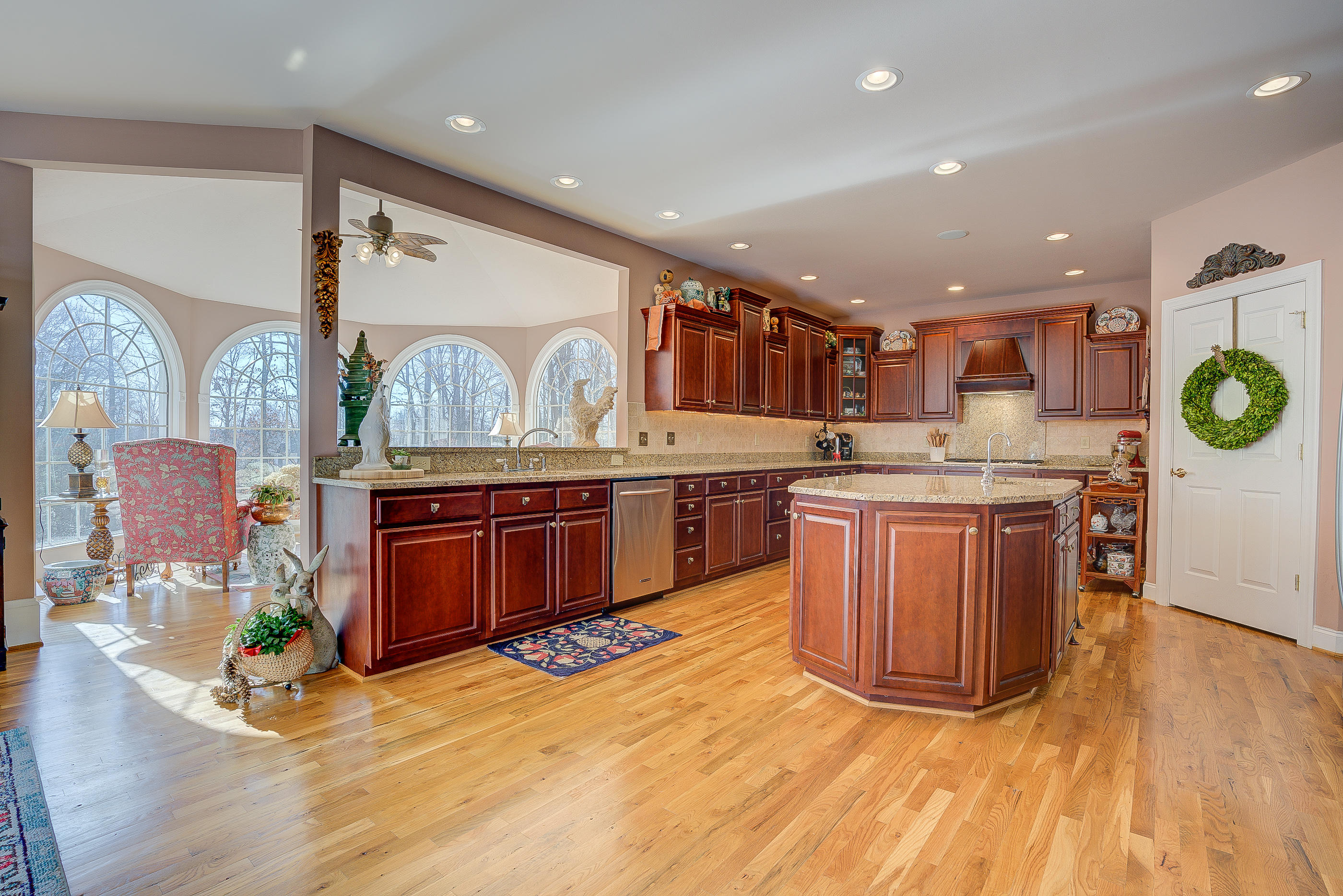 124 Massey Road Stuart, VA 24171 - Photo 11 of 42 a kitchen with stainless steel appliances granite countertop a stove a sink dishwasher and a refrigerator with wooden floor