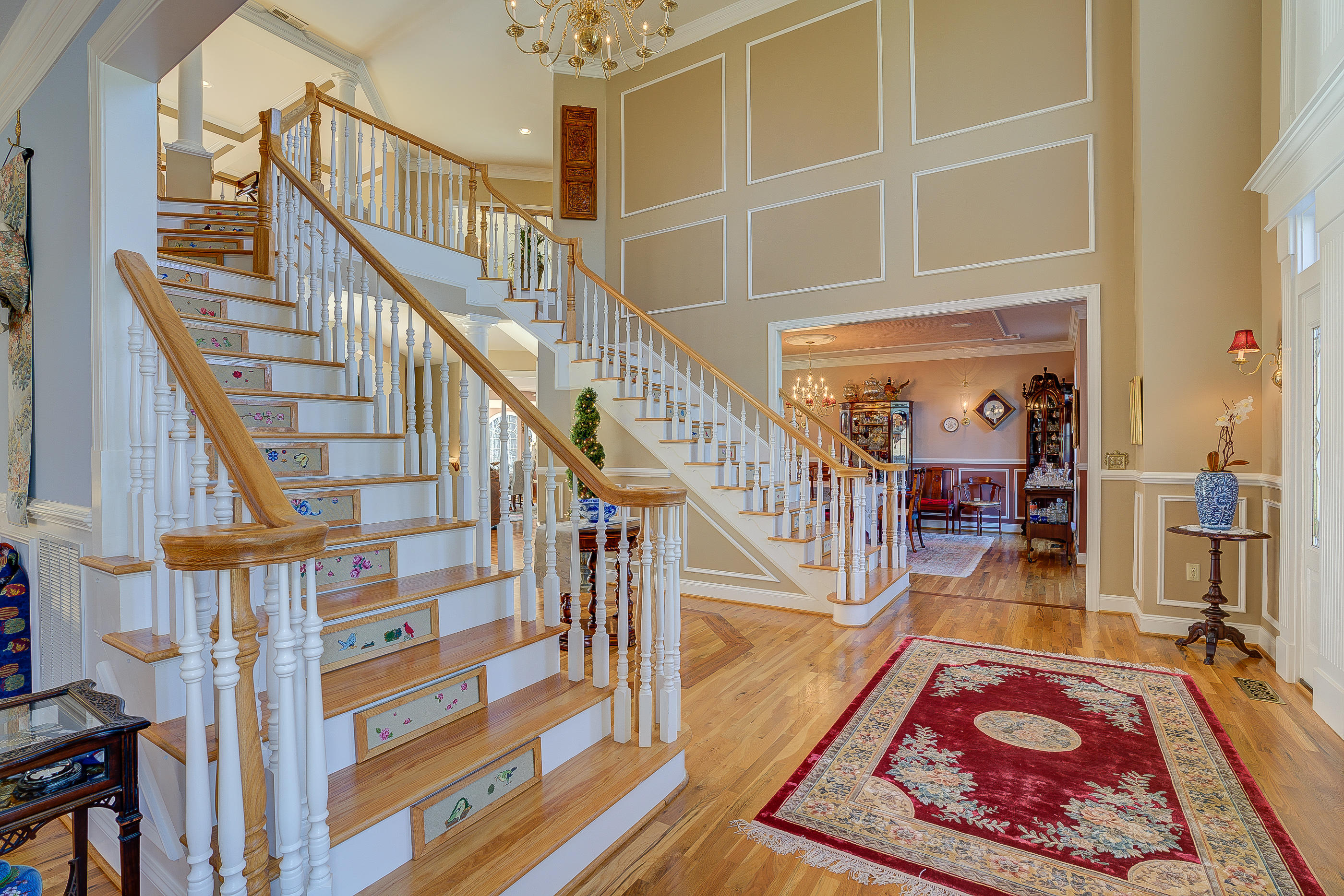 124 Massey Road Stuart, VA 24171 - Photo 8 of 42 a view of staircase with lots of frames on wall and a rug