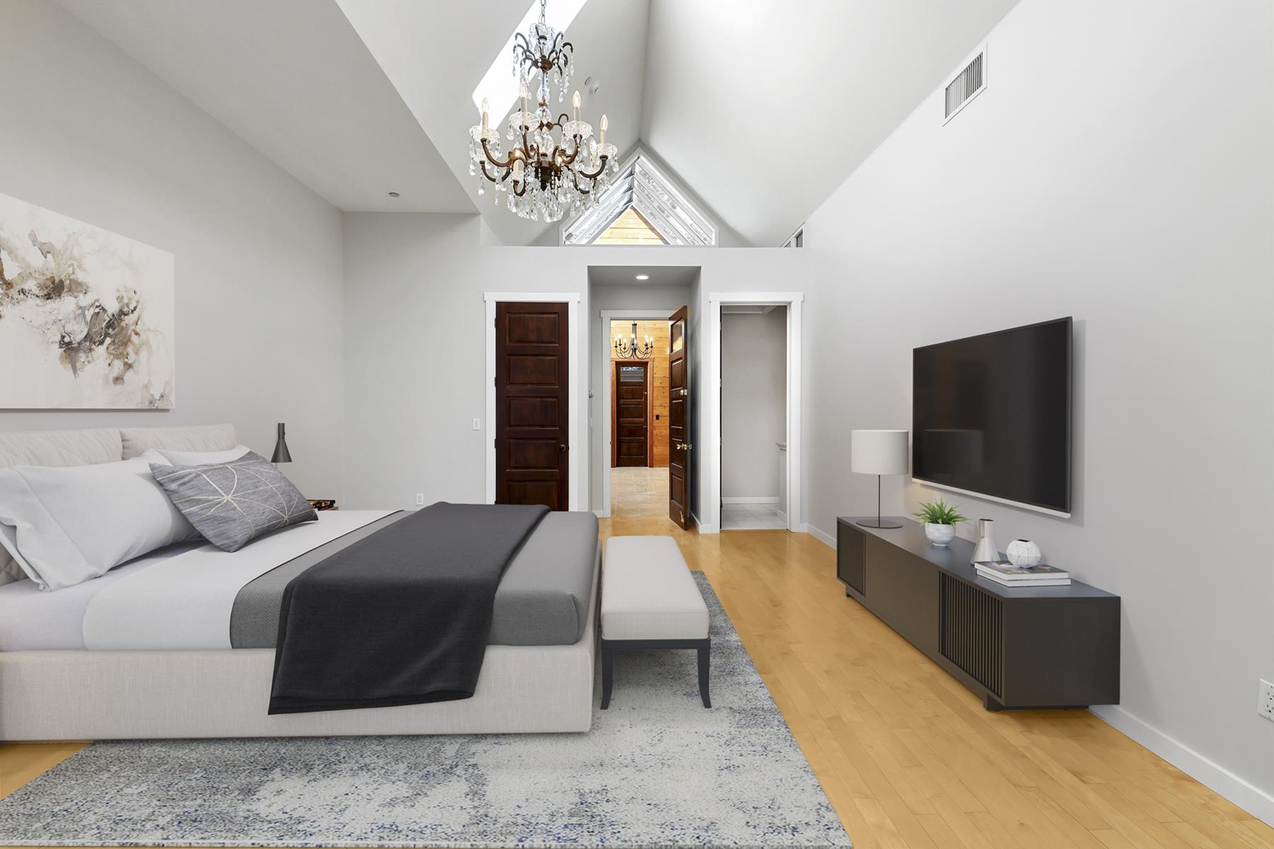 77 Speedboat Avenue Brockway, CA 96143 - Photo 16 of 28 a spacious bedroom with a bed and a flat screen tv