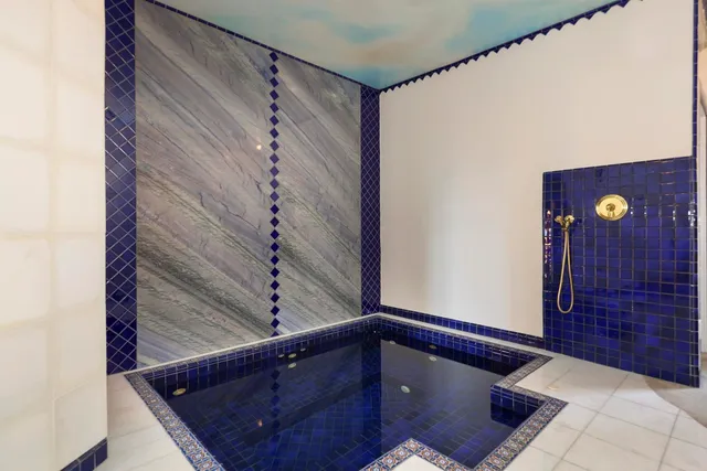 a view of swimming pool with furniture