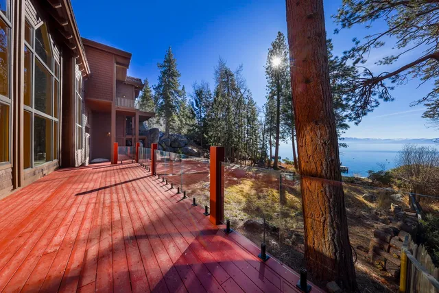 a balcony with couple of couch and chairs