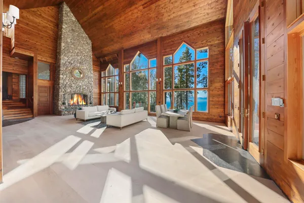 a kitchen with stainless steel appliances granite countertop a sink a stove and a refrigerator