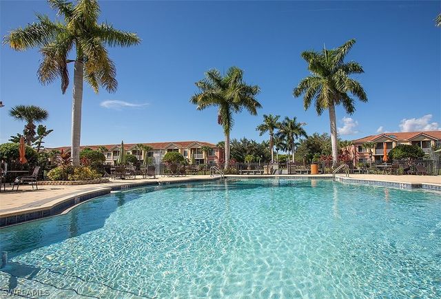 a view of a swimming pool and a yard