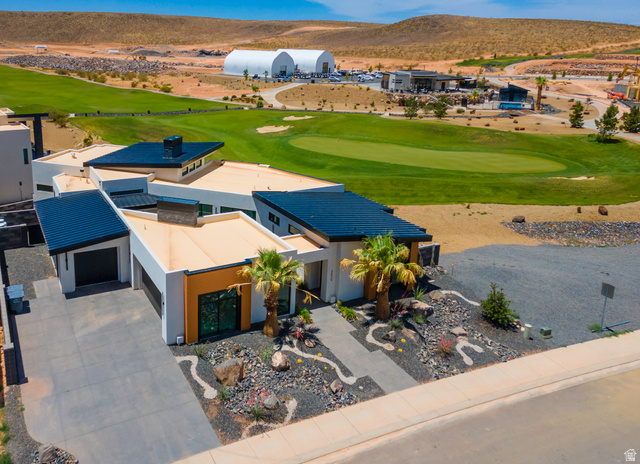 3606 South Cypress Road Hurricane, UT 84737 - Photo 7 of 69 Aerial view of property and surrounding area with a local golf course and a mountain backdrop