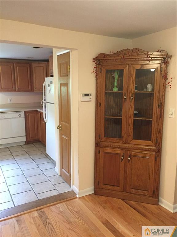 387 Middle Road Hazlet, NJ 07730 - Photo 2 of 20 a view of a refrigerator and window