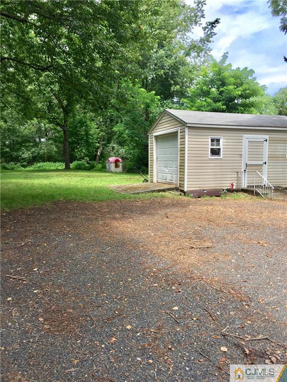 387 Middle Road Hazlet, NJ 07730 - Photo 16 of 20 a view of backyard of house and trees
