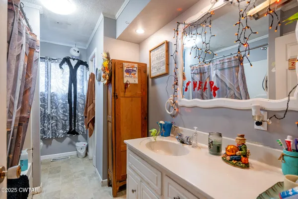 a backyard of a house with yard and outdoor seating