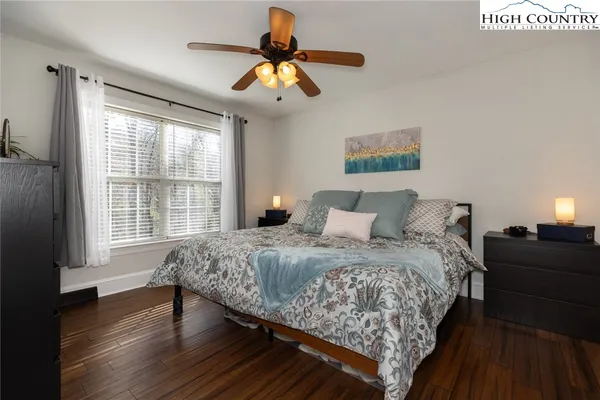 a bedroom with bed and window