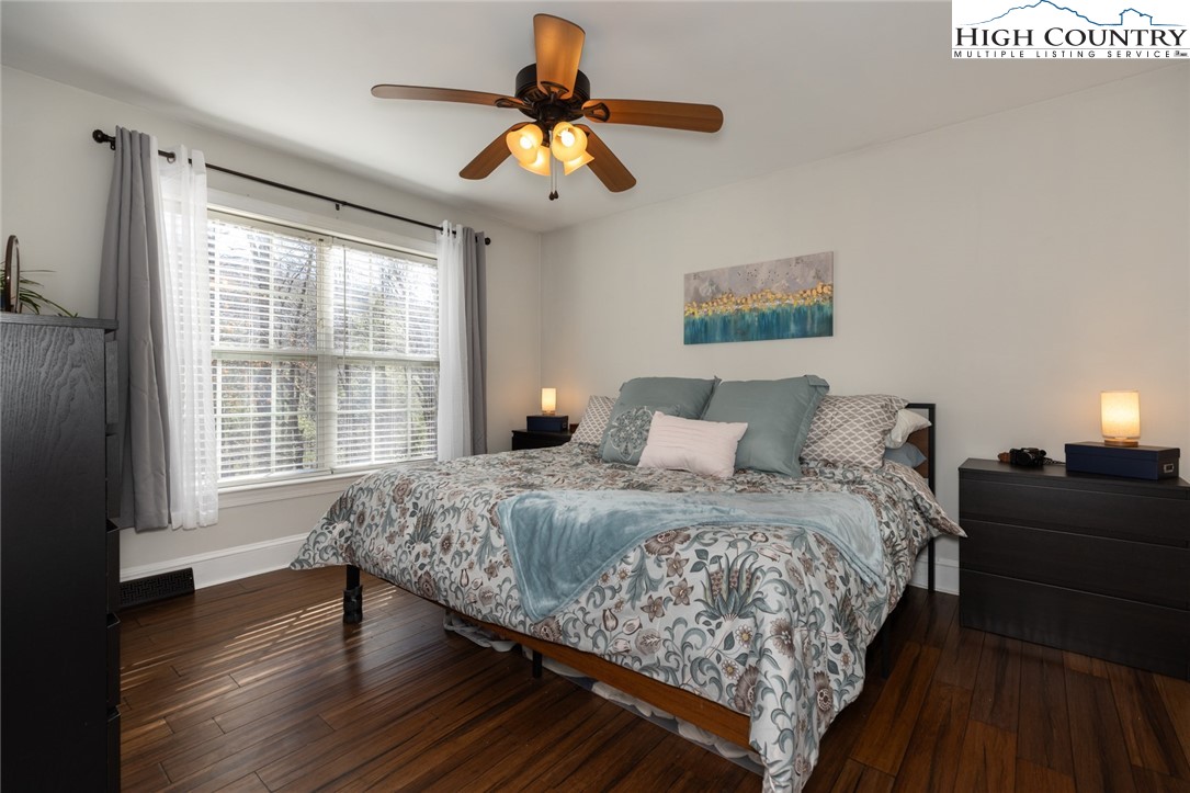 111 Peace Hill Road Fleetwood, NC 28626 - Photo 12 of 49 a bedroom with bed and window