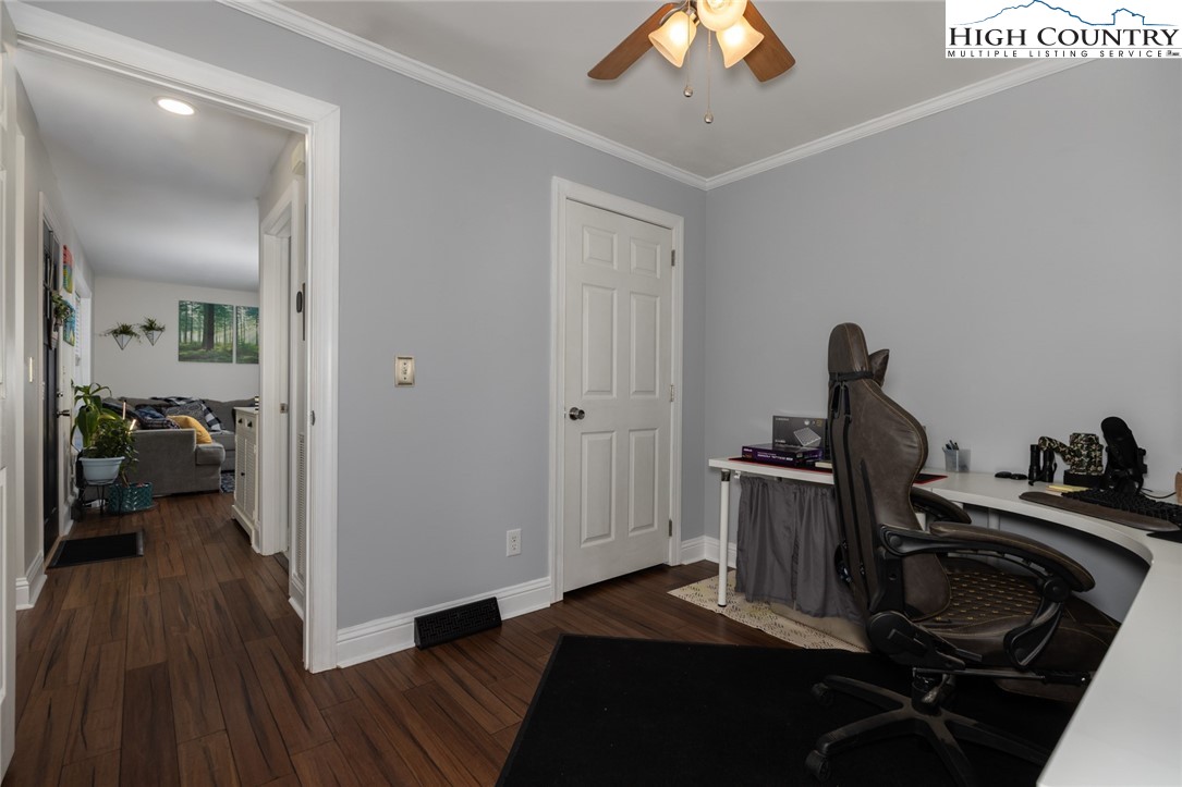111 Peace Hill Road Fleetwood, NC 28626 - Photo 20 of 49 a view of a bedroom with a bed and wooden floor