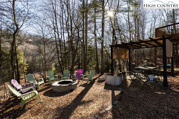 a view of outdoor space with lots of chairs and entertaining space