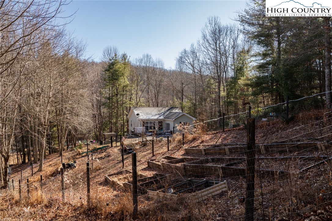 111 Peace Hill Road Fleetwood, NC 28626 - Photo 3 of 49 a view of a house with a yard