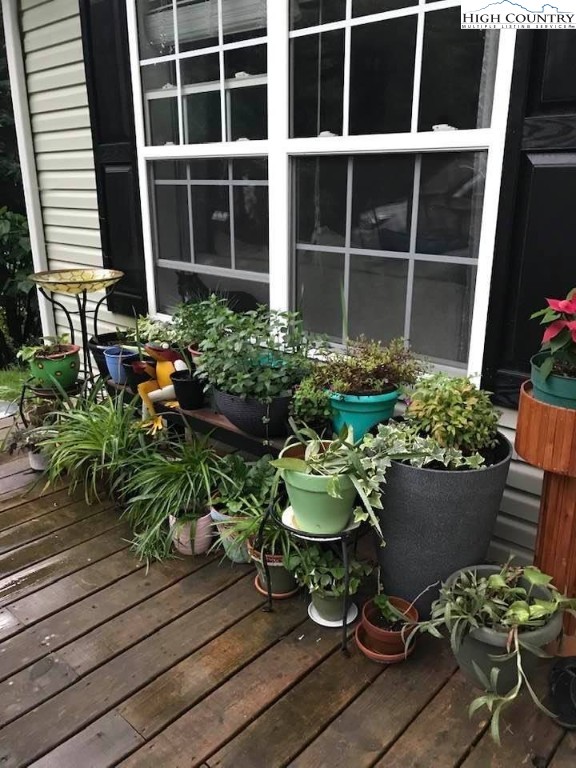 111 Peace Hill Road Fleetwood, NC 28626 - Photo 32 of 49 a view of a chair and table in back yard of a house