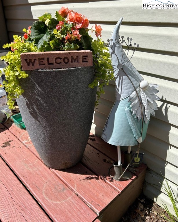 111 Peace Hill Road Fleetwood, NC 28626 - Photo 41 of 49 a wooden bench sitting in front of a building