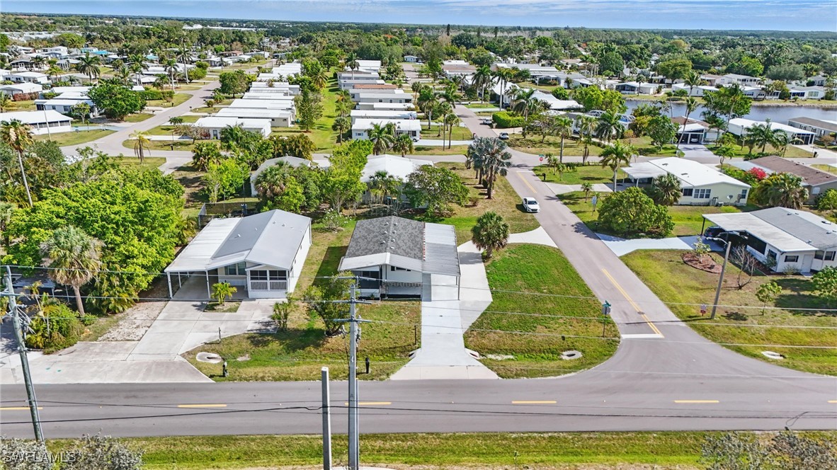 897 Manatee Road Naples, FL 34114 - Photo 32 of 36 an aerial view of residential houses with yard
