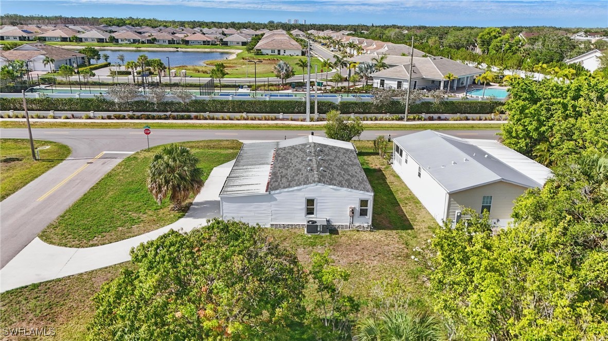 897 Manatee Road Naples, FL 34114 - Photo 34 of 36 an aerial view of a house with a swimming pool