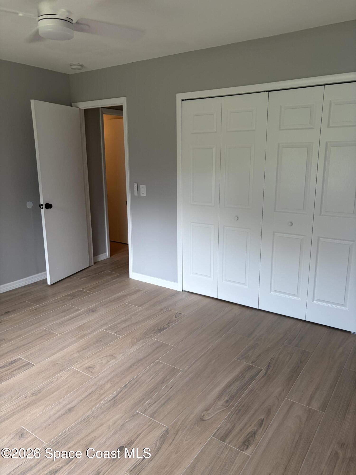 1136 Minnet Court Northeast Palm Bay, FL 32905 - Photo 3 of 31 Primary Bedroom 1