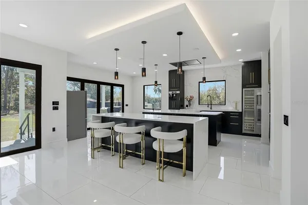 a spacious bathroom with a toilet sink and mirror