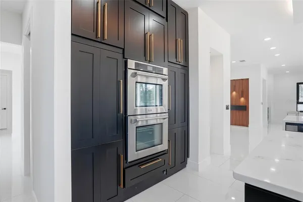 wooden floor and a bathroom with a mirror
