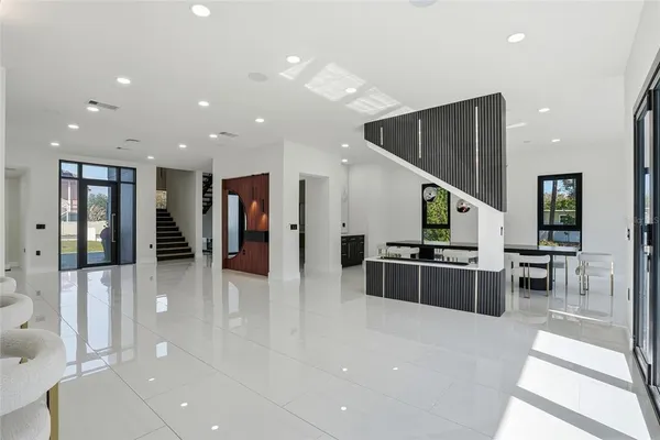 a spacious bedroom with a bed and a ceiling fan