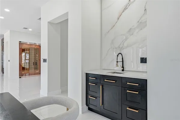 a bathroom with a sink mirror and shower