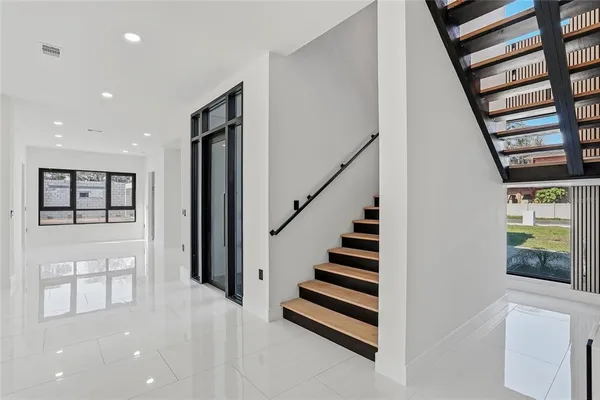 a view of a livingroom with furniture and a flat screen tv
