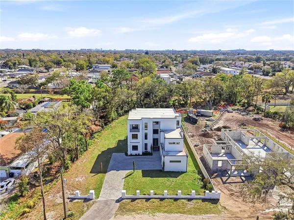 a kitchen with stainless steel appliances kitchen island granite top and refrigerator