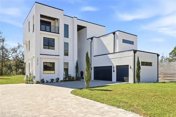 a kitchen with stainless steel appliances granite countertop a stove and more cabinets