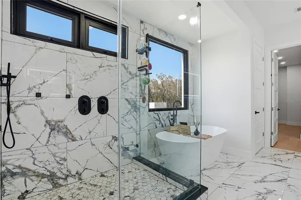 a bathroom with a toilet sink and shower