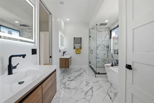 a view of a patio with a chairs and table in a patio