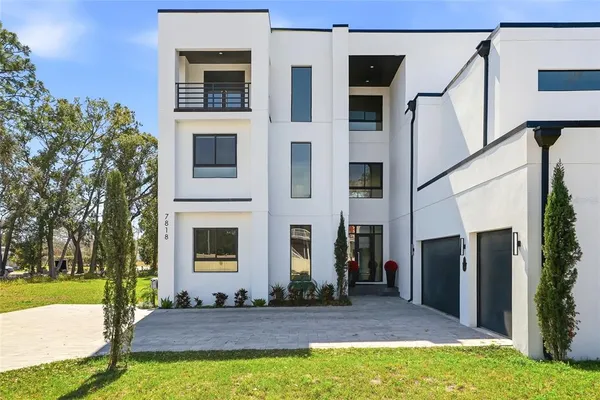 a kitchen with stainless steel appliances granite countertop a stove and a refrigerator